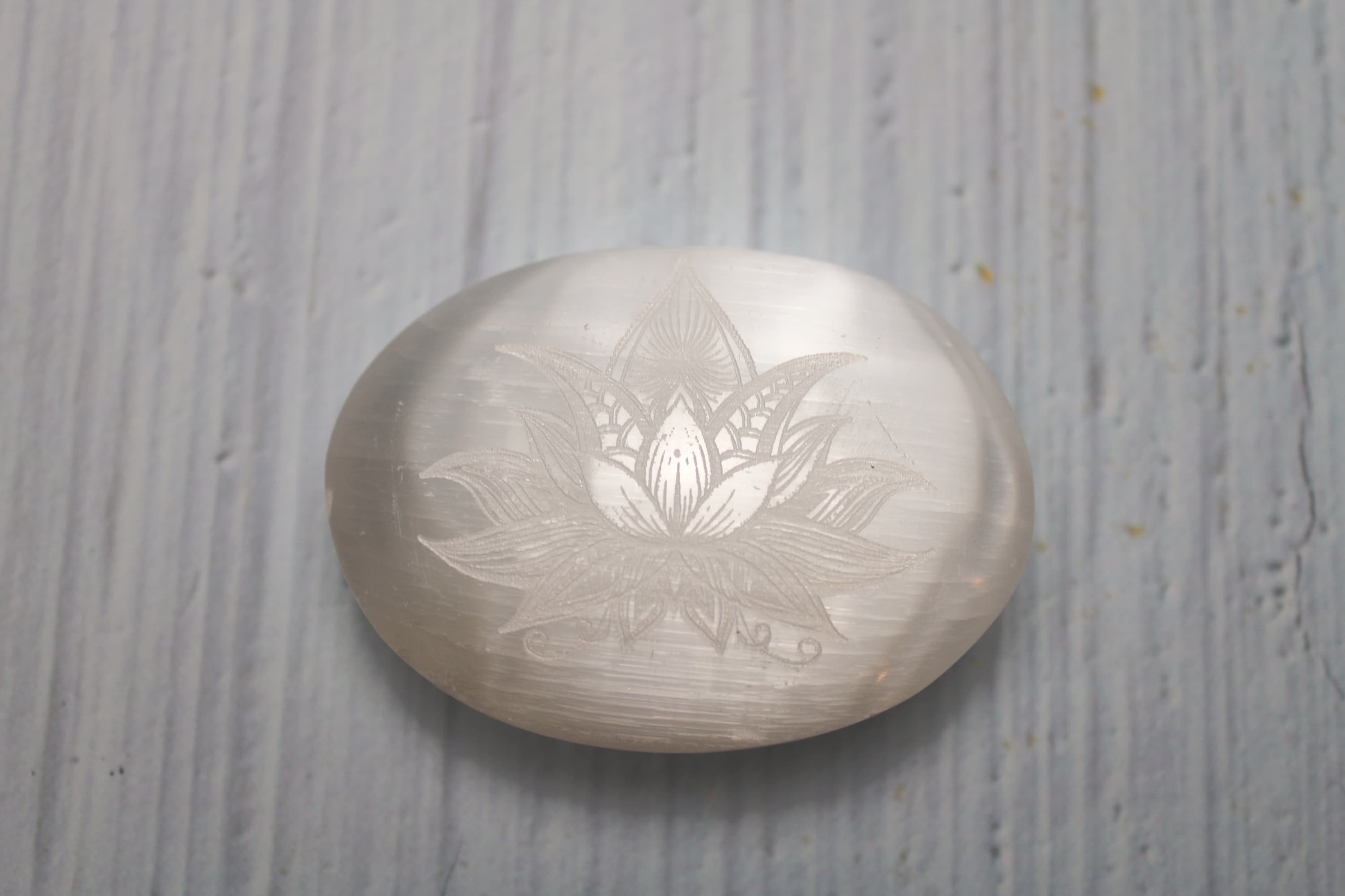 Lotus Flower Etched Selenite Palm Stone - Image 1