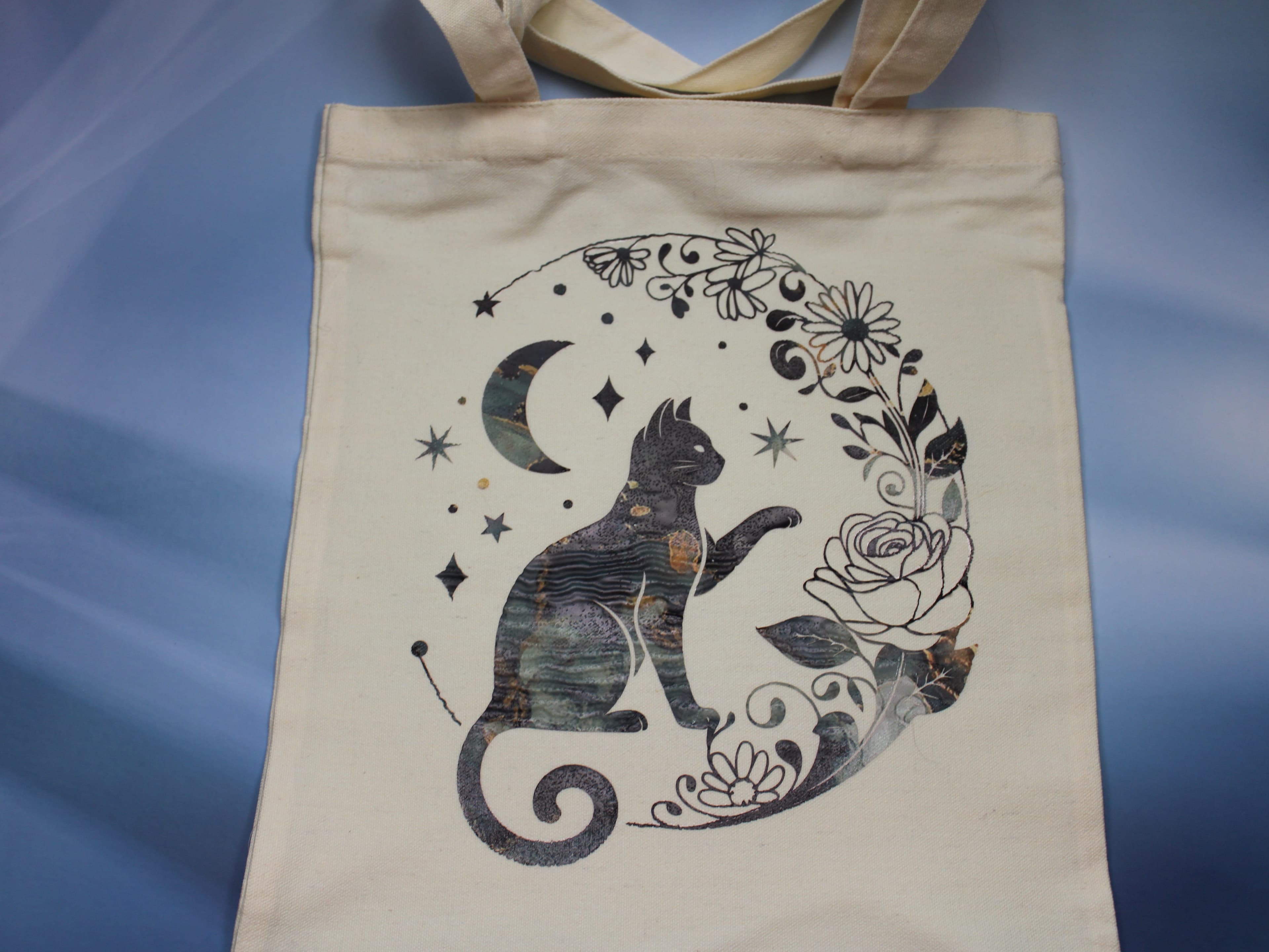 The Cat and the Crescent Moon Tote Bag - Image 1